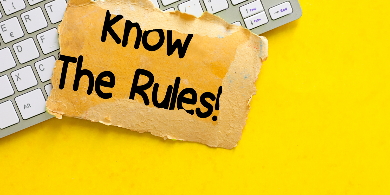 Auf einem Zettel, der auf einer Computertastatur liegt, steht: 'Know the rules!'