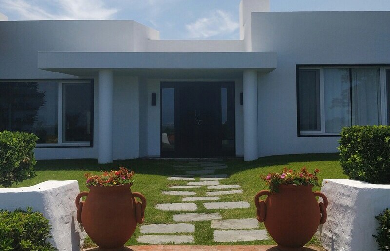 Haus und Garten - Flaggen des Wohlstandes. / Guillherme Hellwinkel, Unsplash